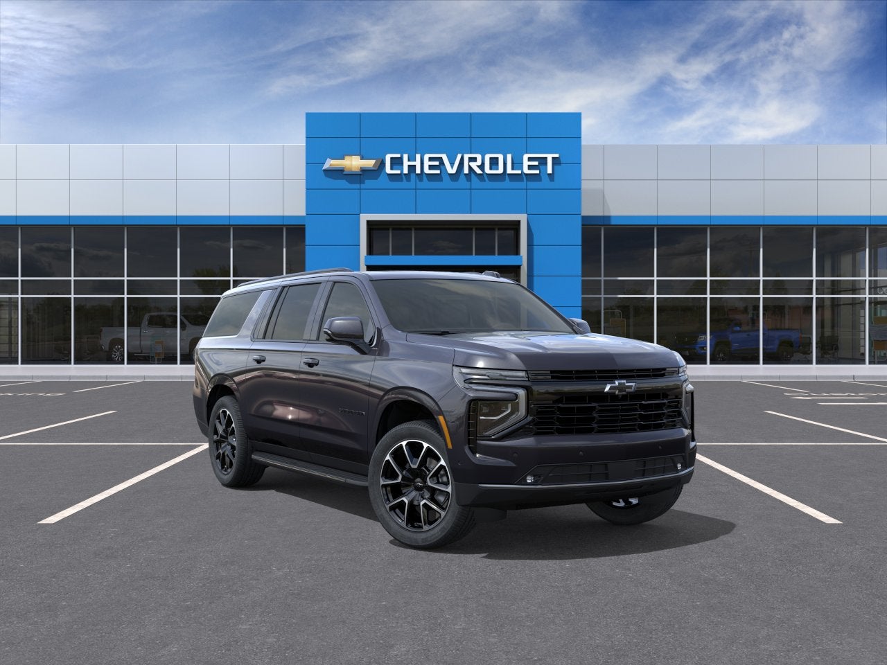 2026 Chevrolet Suburban RST in Dark Ash Metallic — front three-quarter view